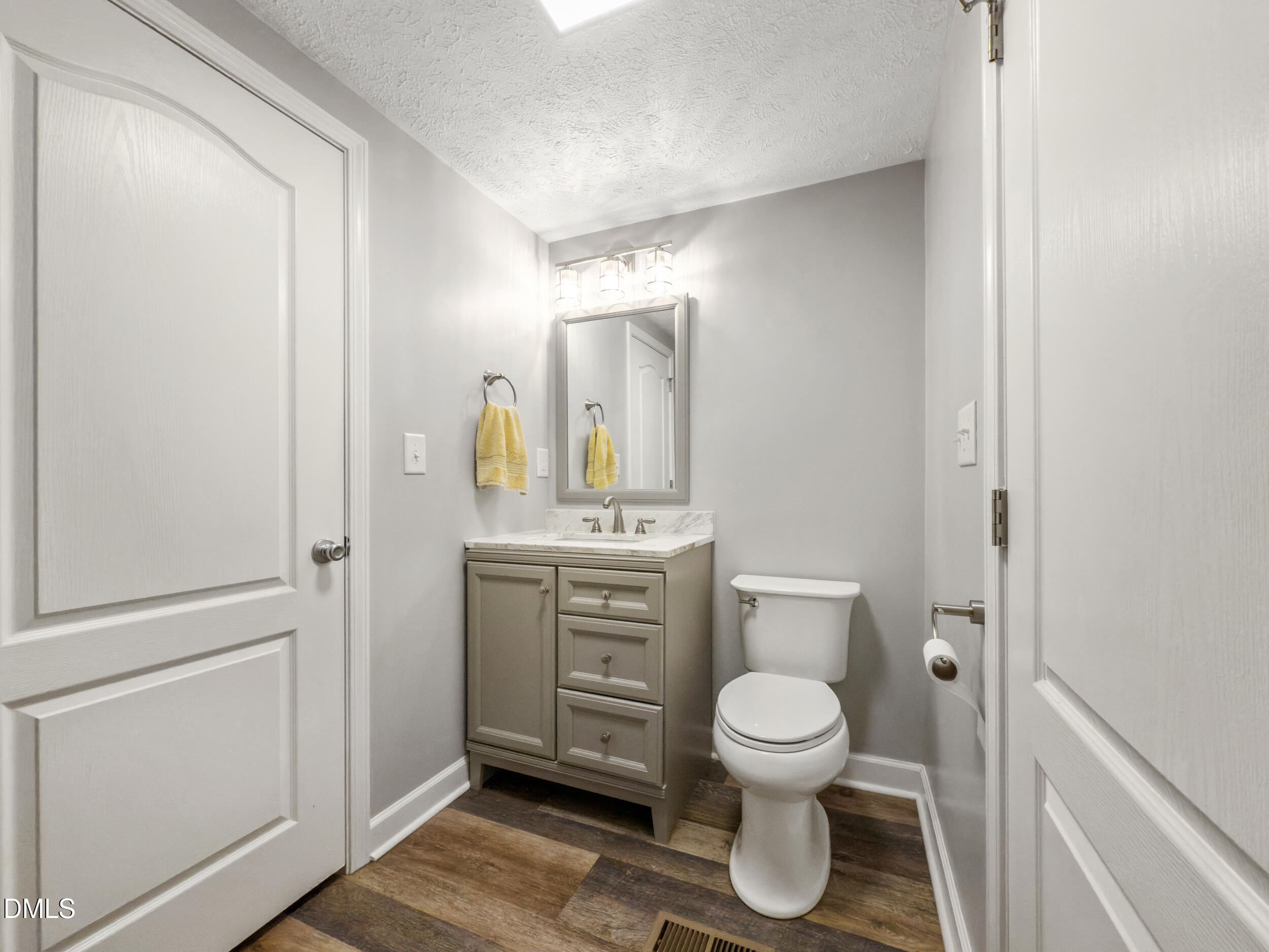 8056 Concord Church Road Autryville, NC 28318 - Photo 19 of 48 a bathroom with a toilet a sink and mirror