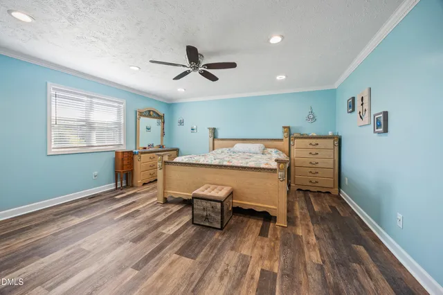 a view of a livingroom with furniture and a window