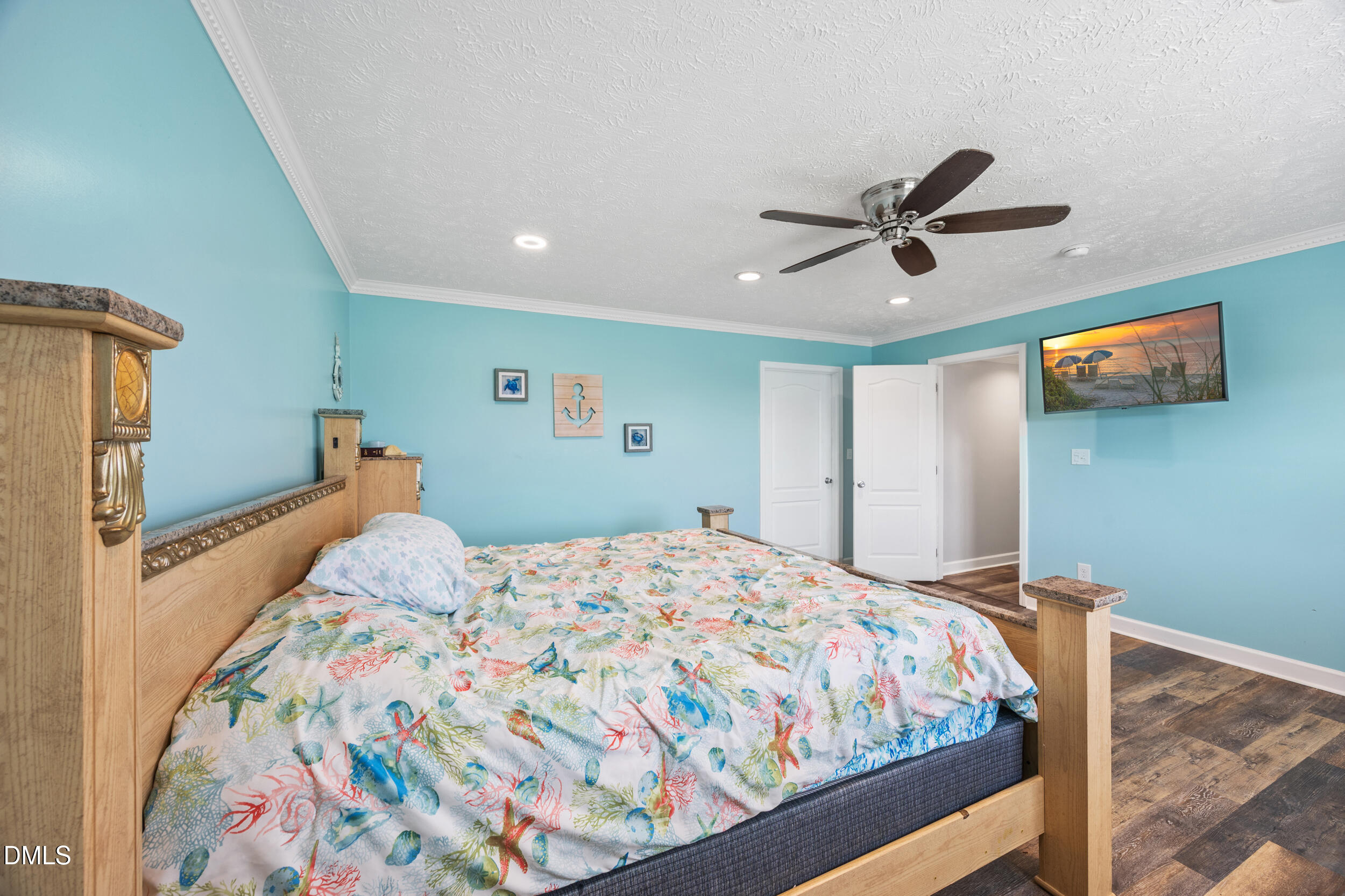 8056 Concord Church Road Autryville, NC 28318 - Photo 24 of 48 a bedroom with a bed and a flat screen tv