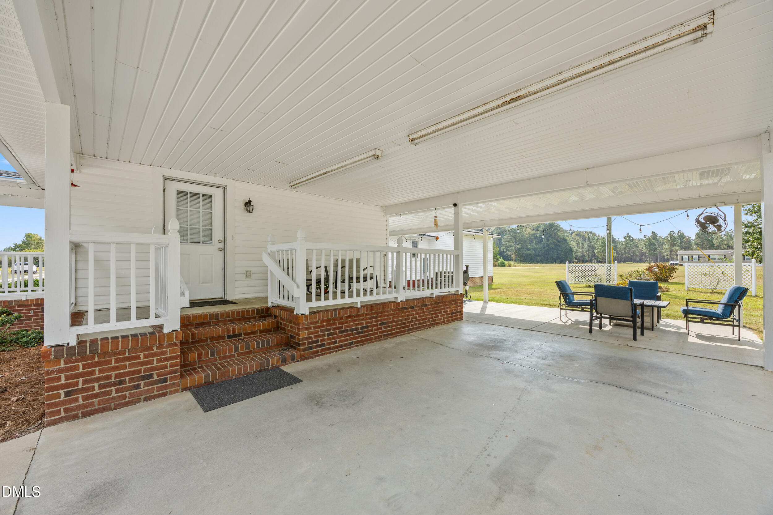 8056 Concord Church Road Autryville, NC 28318 - Photo 29 of 48 a living room with furniture and a flat screen tv