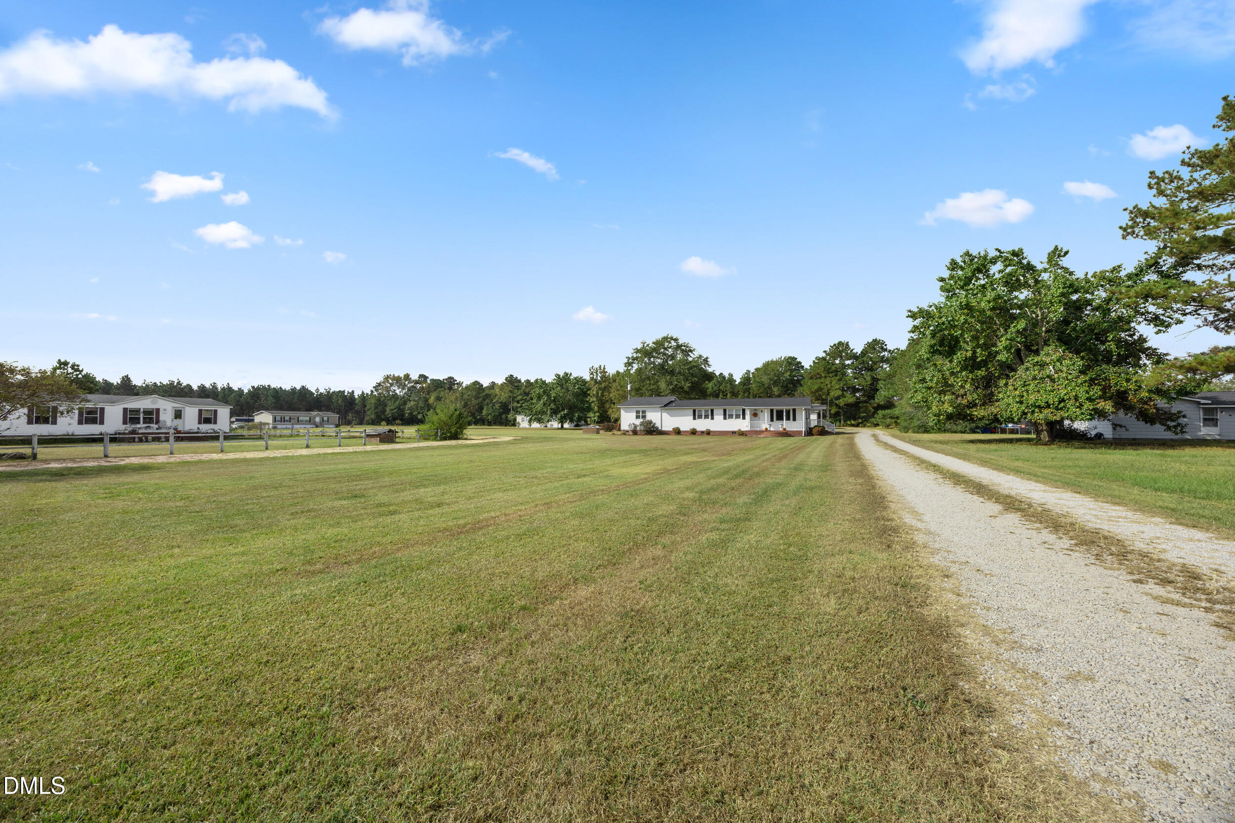 8056 Concord Church Road Autryville, NC 28318 - Photo 32 of 48 a view of a lake with houses in the back