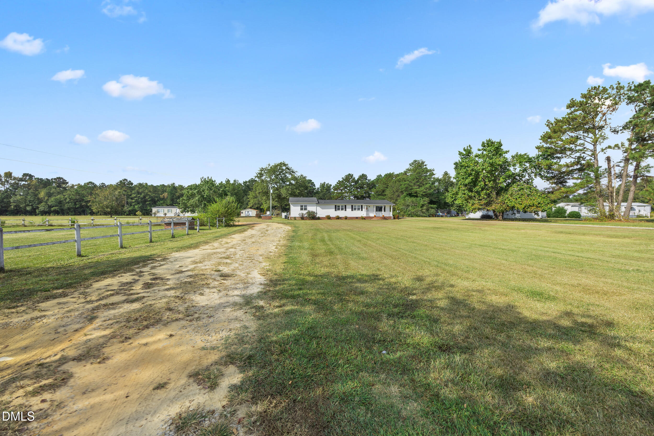 8056 Concord Church Road Autryville, NC 28318 - Photo 33 of 48 a view of a lake with houses in the background