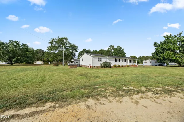 a view of a house with a big yard