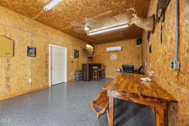 a view of room with furniture and wooden floor