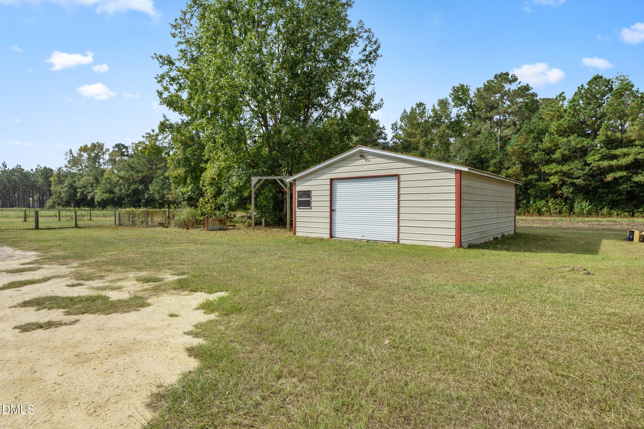 8056 Concord Church Road Autryville, NC 28318 - Photo 42 of 48 a view of a backyard with large trees