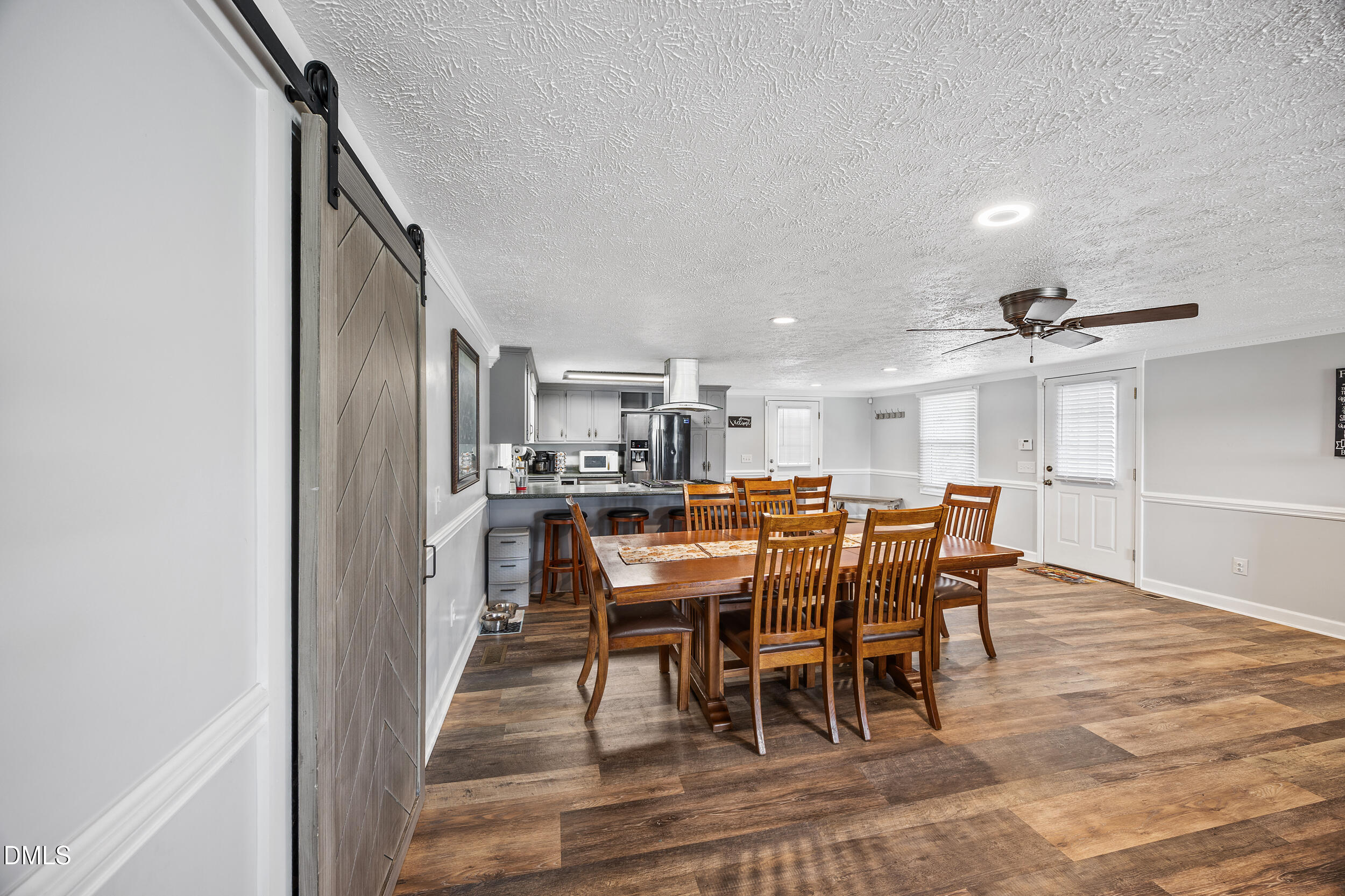 8056 Concord Church Road Autryville, NC 28318 - Photo 7 of 48 a view of a dining room with furniture and wooden floor