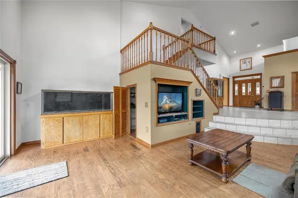 a living room with furniture or fireplace and a chandelier