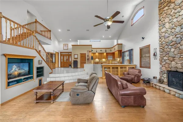 a spacious bedroom with a bed and a chandelier