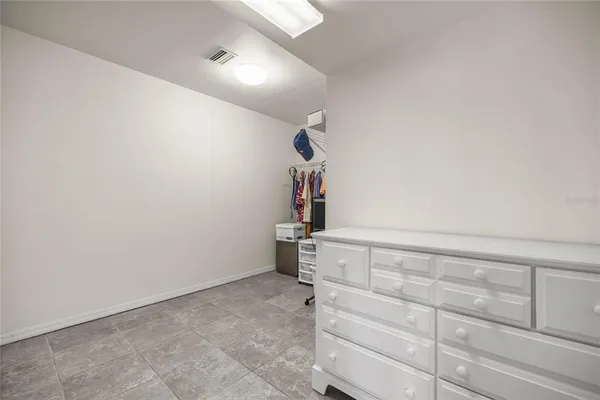 a large bathroom with a double vanity sink and a mirror