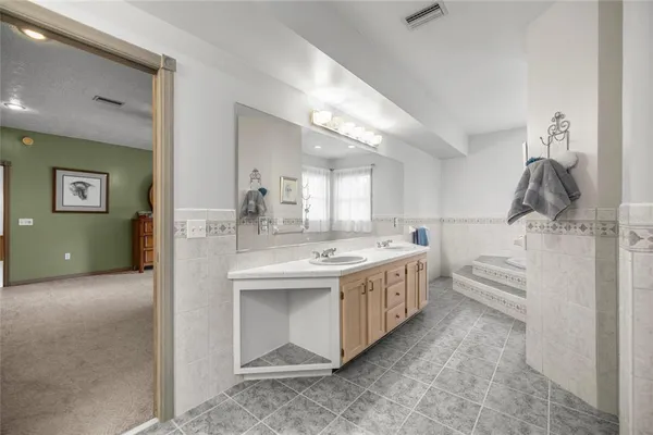 a view of a livingroom with a chandelier fan