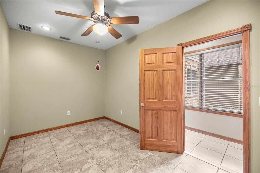 4559 West Dunklin Street Dunnellon, FL 34433 - Photo 22 of 65 a view of a livingroom with a chandelier fan