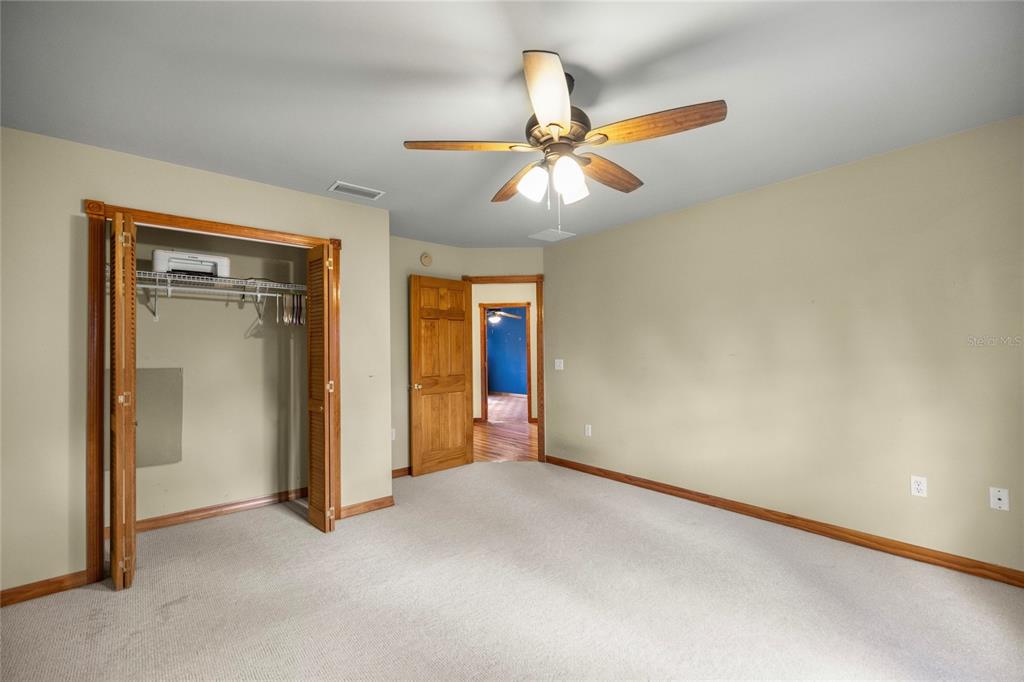 4559 West Dunklin Street Dunnellon, FL 34433 - Photo 28 of 65 a view of an empty room and chandelier fan