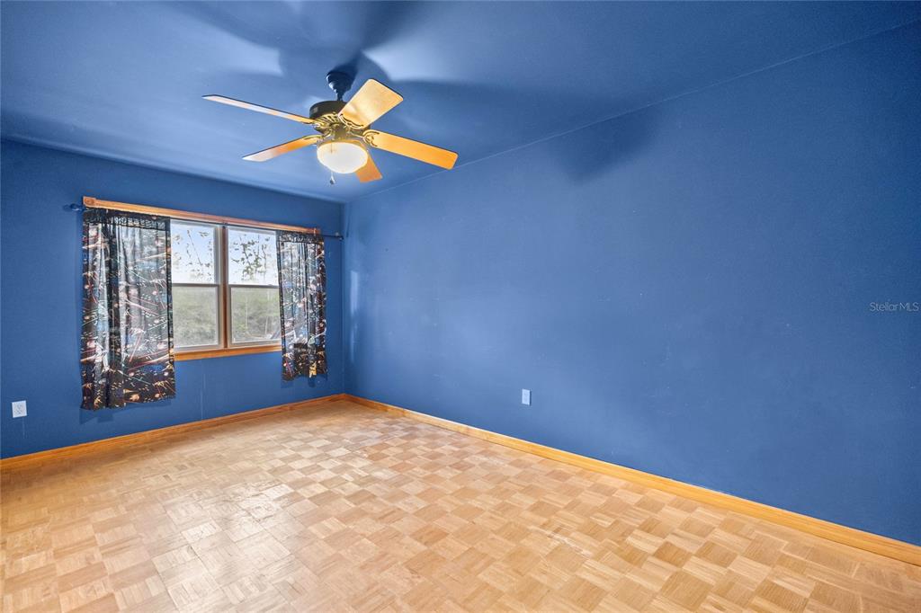 4559 West Dunklin Street Dunnellon, FL 34433 - Photo 33 of 65 a view of an empty room with window and chandelier fan