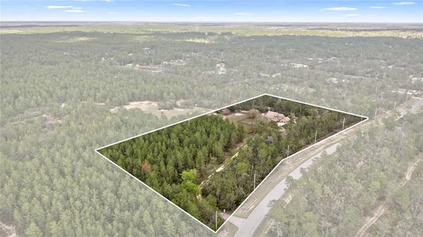 a kitchen with stainless steel appliances granite countertop a refrigerator and a stove