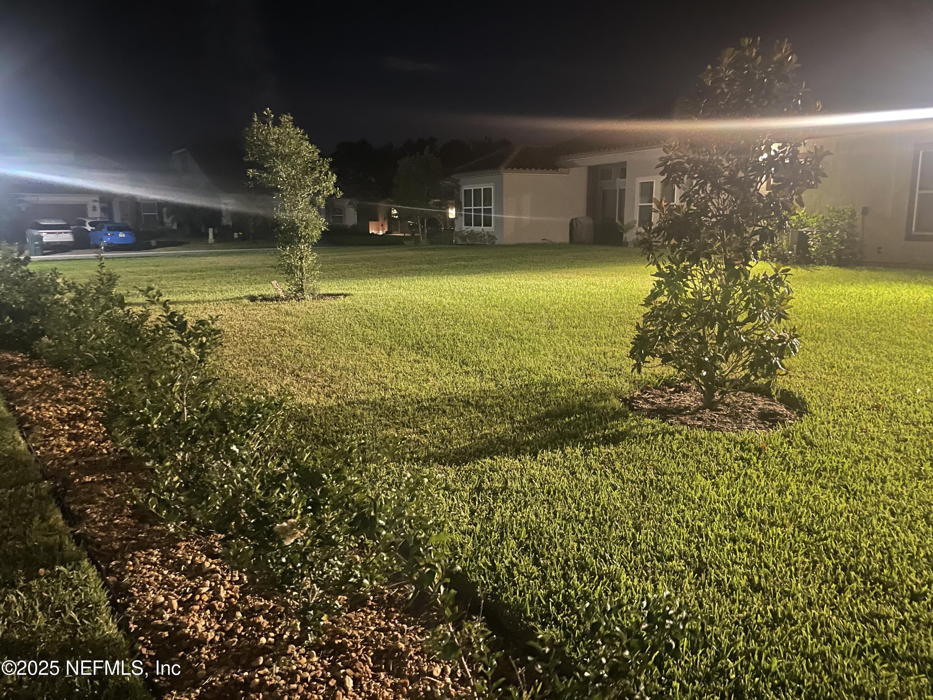 2489 Caprera Circle Jacksonville, FL 32246 - Photo 3 of 23 a view of a swimming pool with an outdoor seating and a yard