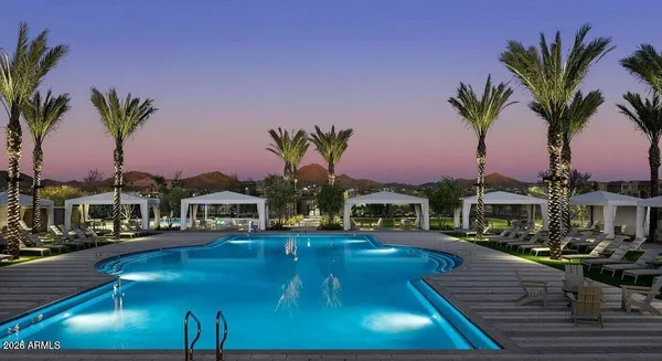 a swimming pool with outdoor seating and yard