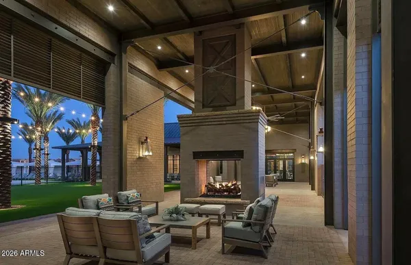 a swimming pool with outdoor seating and yard