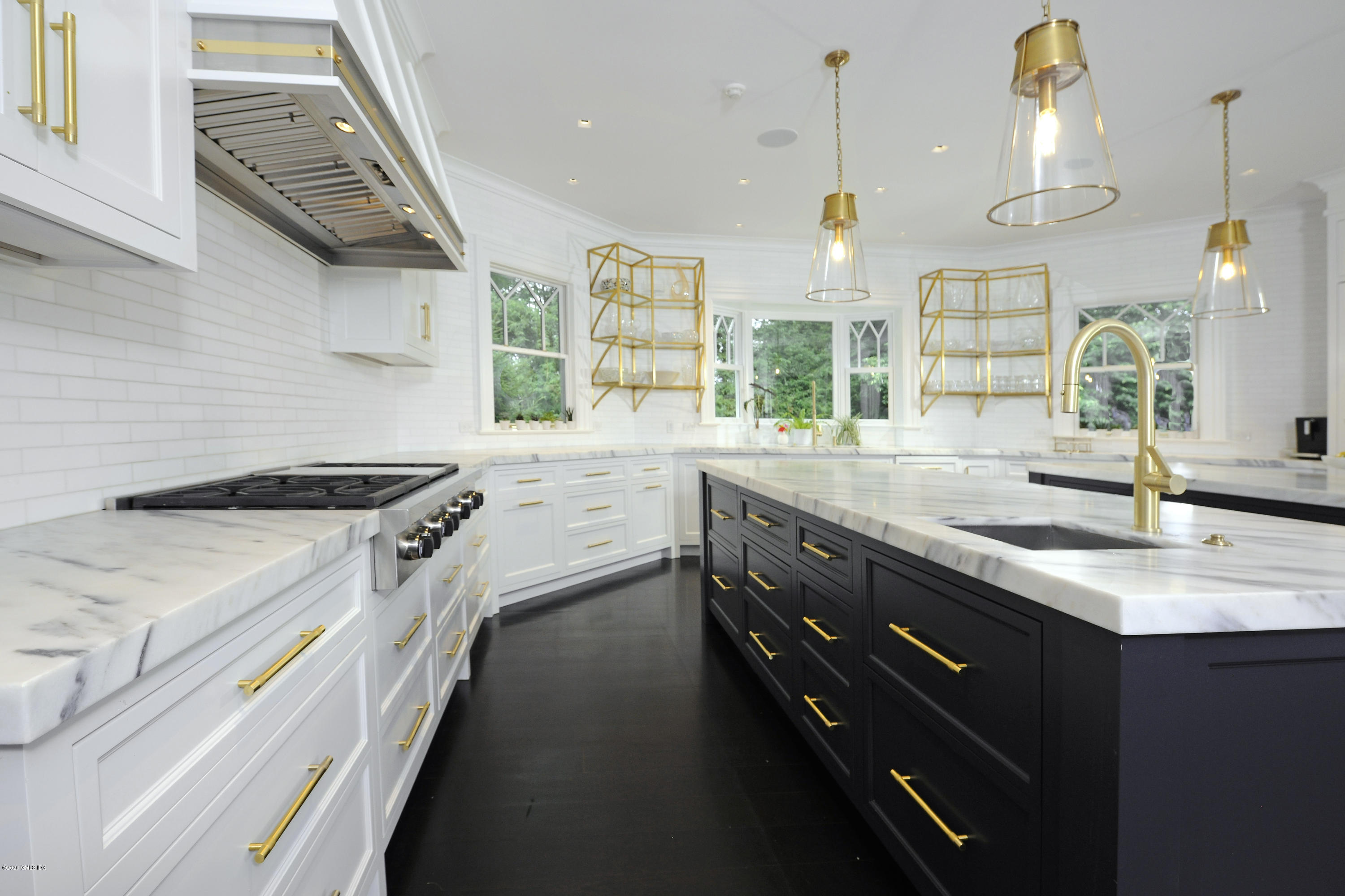 31 Rock Ridge Avenue Greenwich, CT 06831 - Photo 11 of 44 a kitchen with a sink stove and window