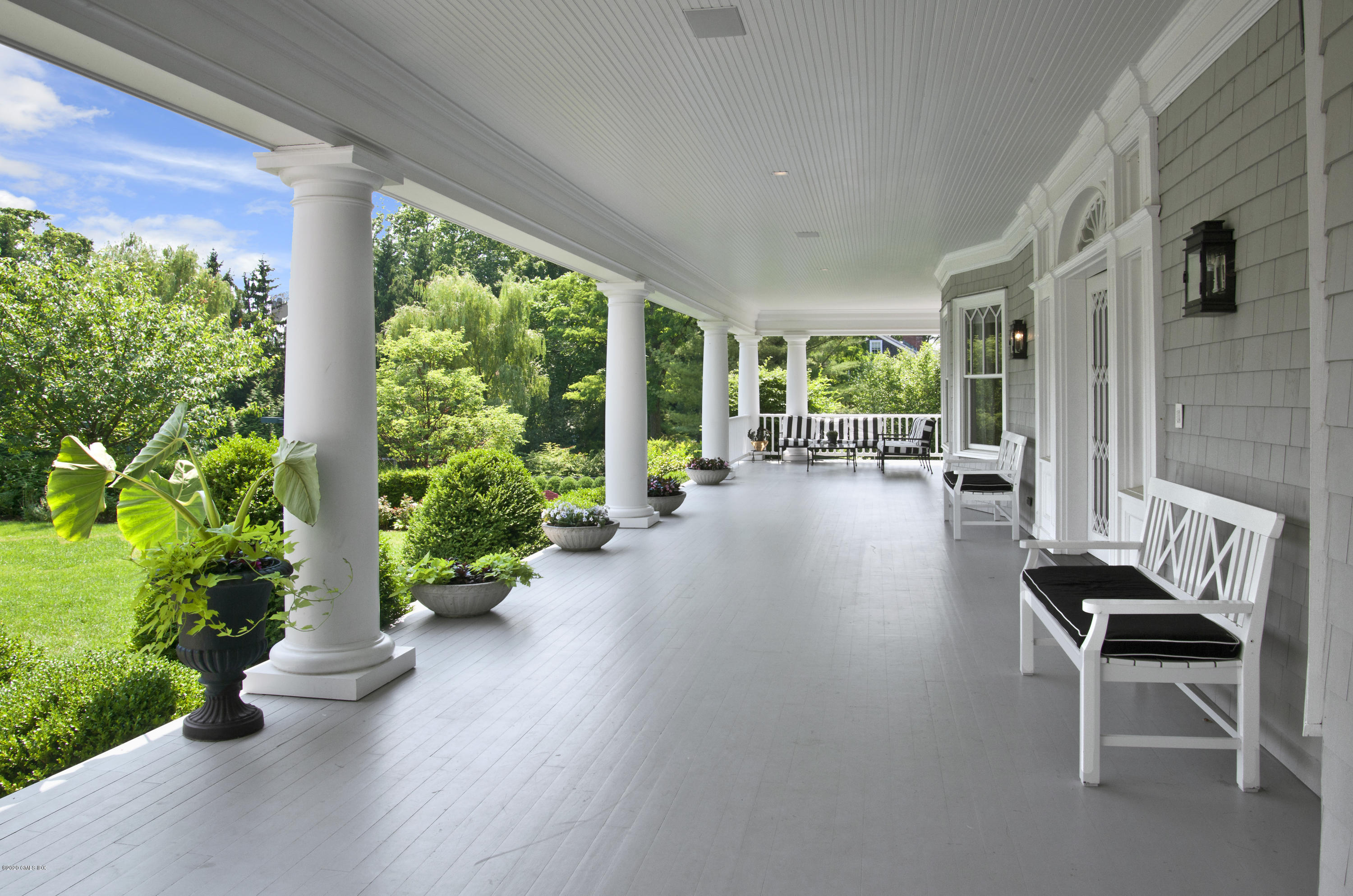 31 Rock Ridge Avenue Greenwich, CT 06831 - Photo 17 of 44 a view of a porch with chairs and potted plants