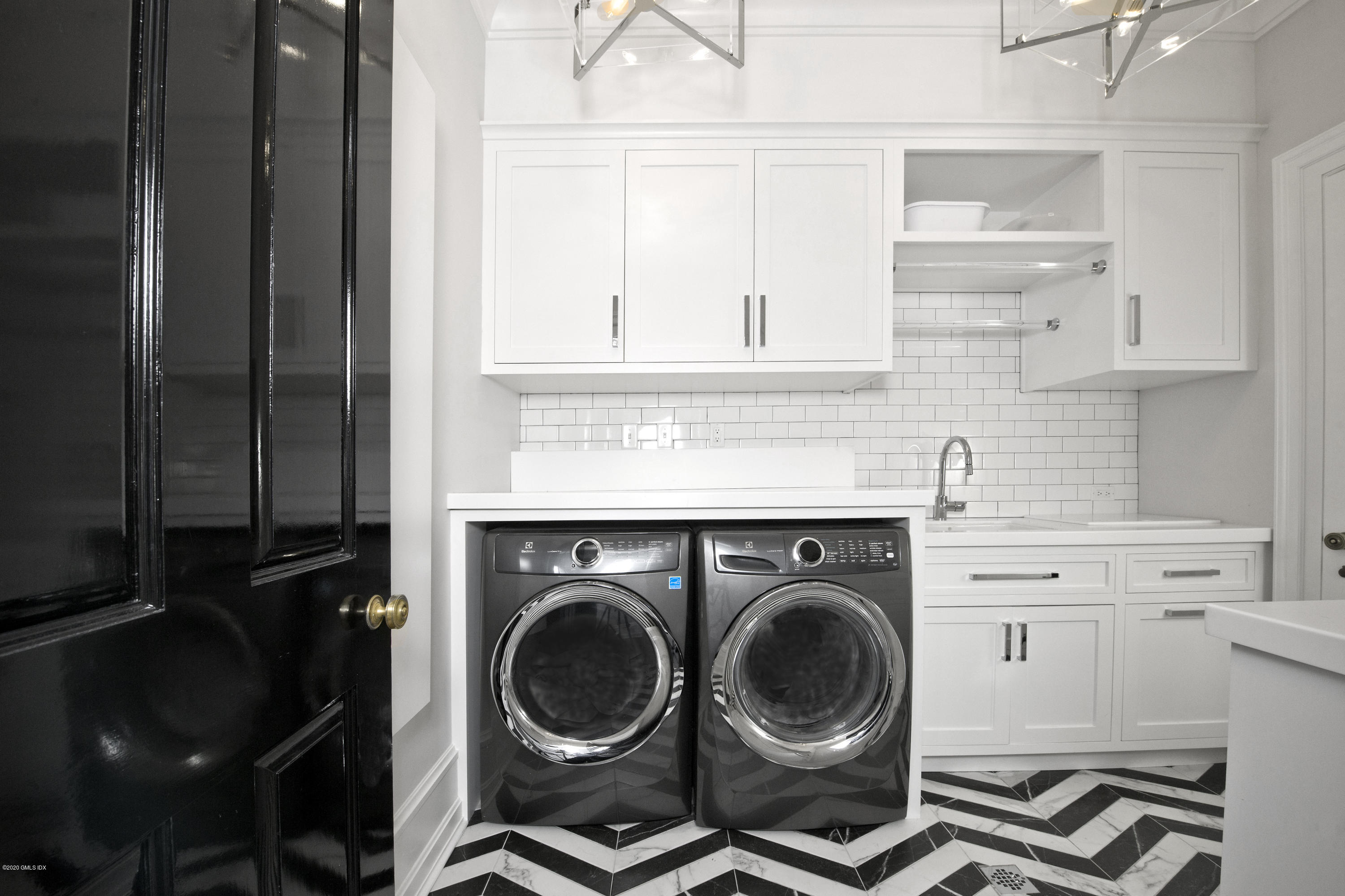 31 Rock Ridge Avenue Greenwich, CT 06831 - Photo 19 of 44 a utility room with sink dryer and washer