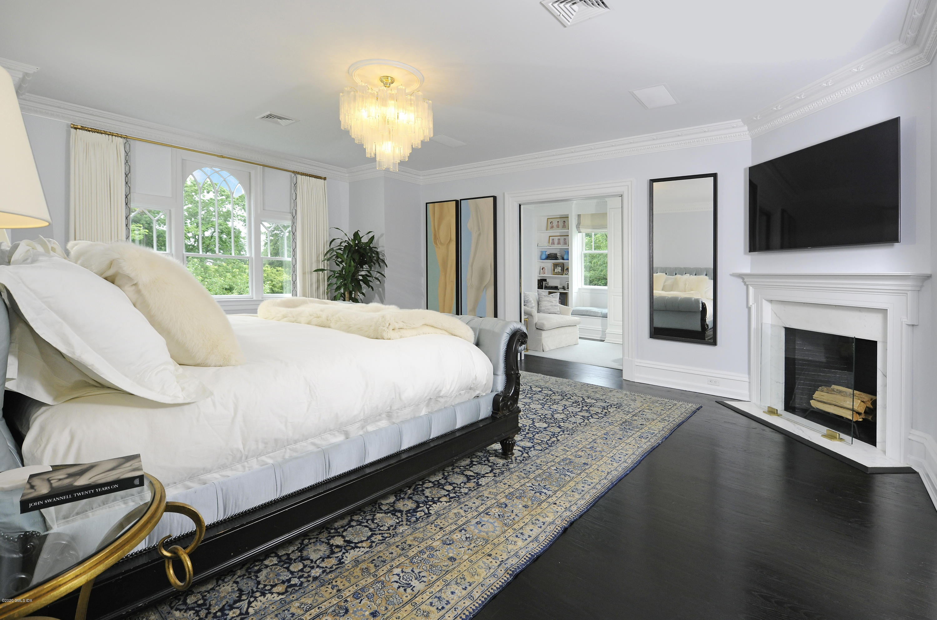 31 Rock Ridge Avenue Greenwich, CT 06831 - Photo 21 of 44 a spacious bedroom with a bed and a flat screen tv