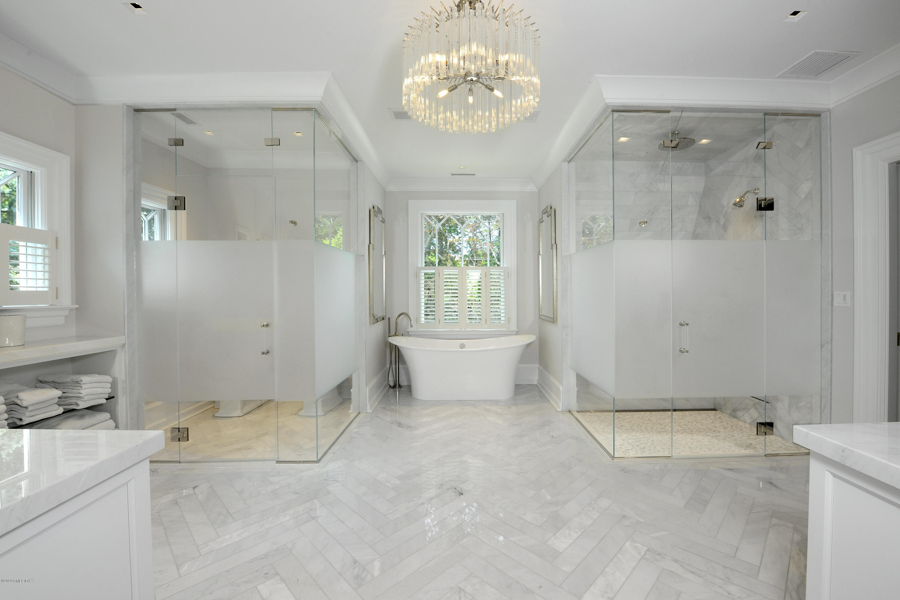 31 Rock Ridge Avenue Greenwich, CT 06831 - Photo 24 of 44 a view of a bathroom with a tub shower and sink