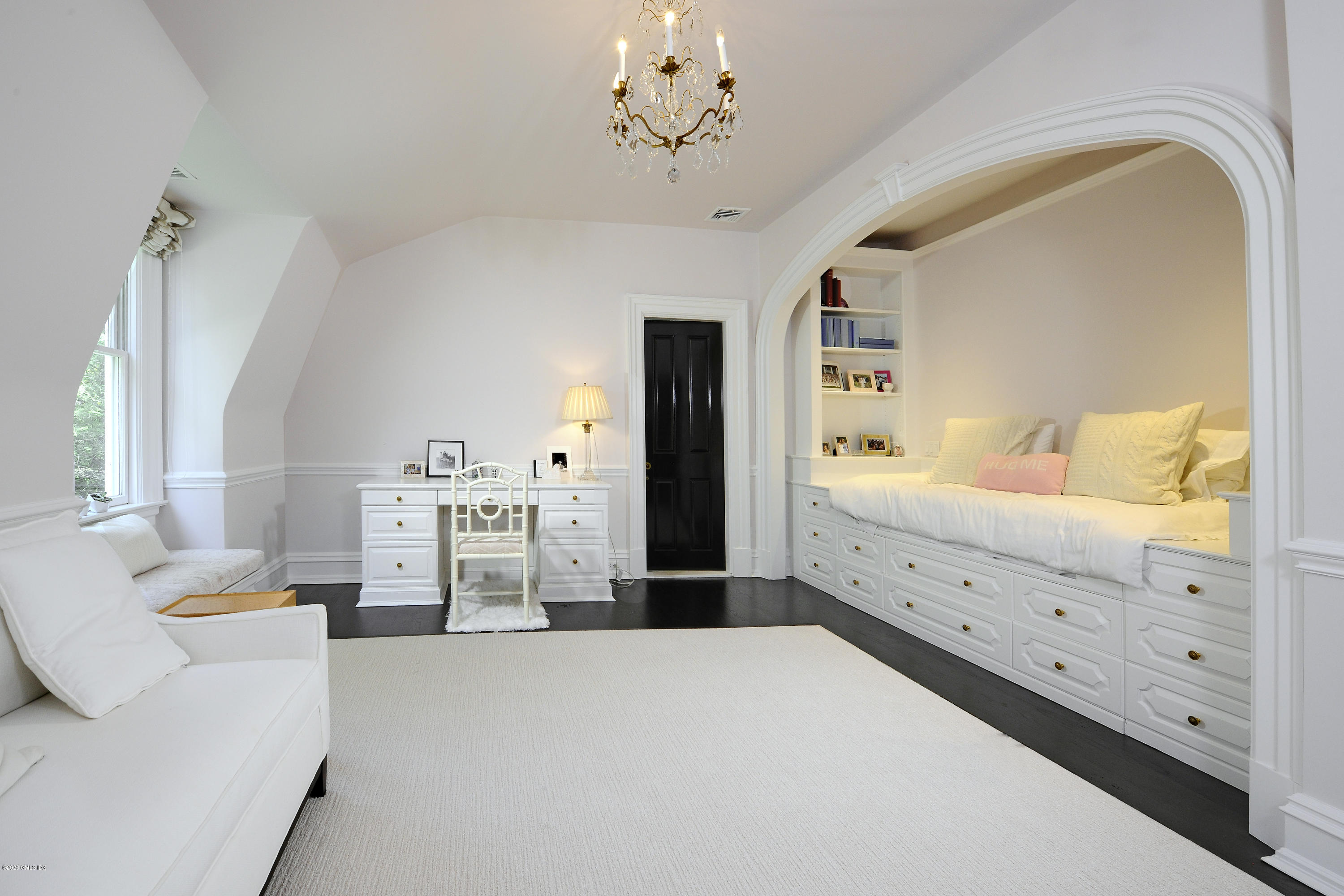 31 Rock Ridge Avenue Greenwich, CT 06831 - Photo 28 of 44 a bed room with a bed and a chandelier