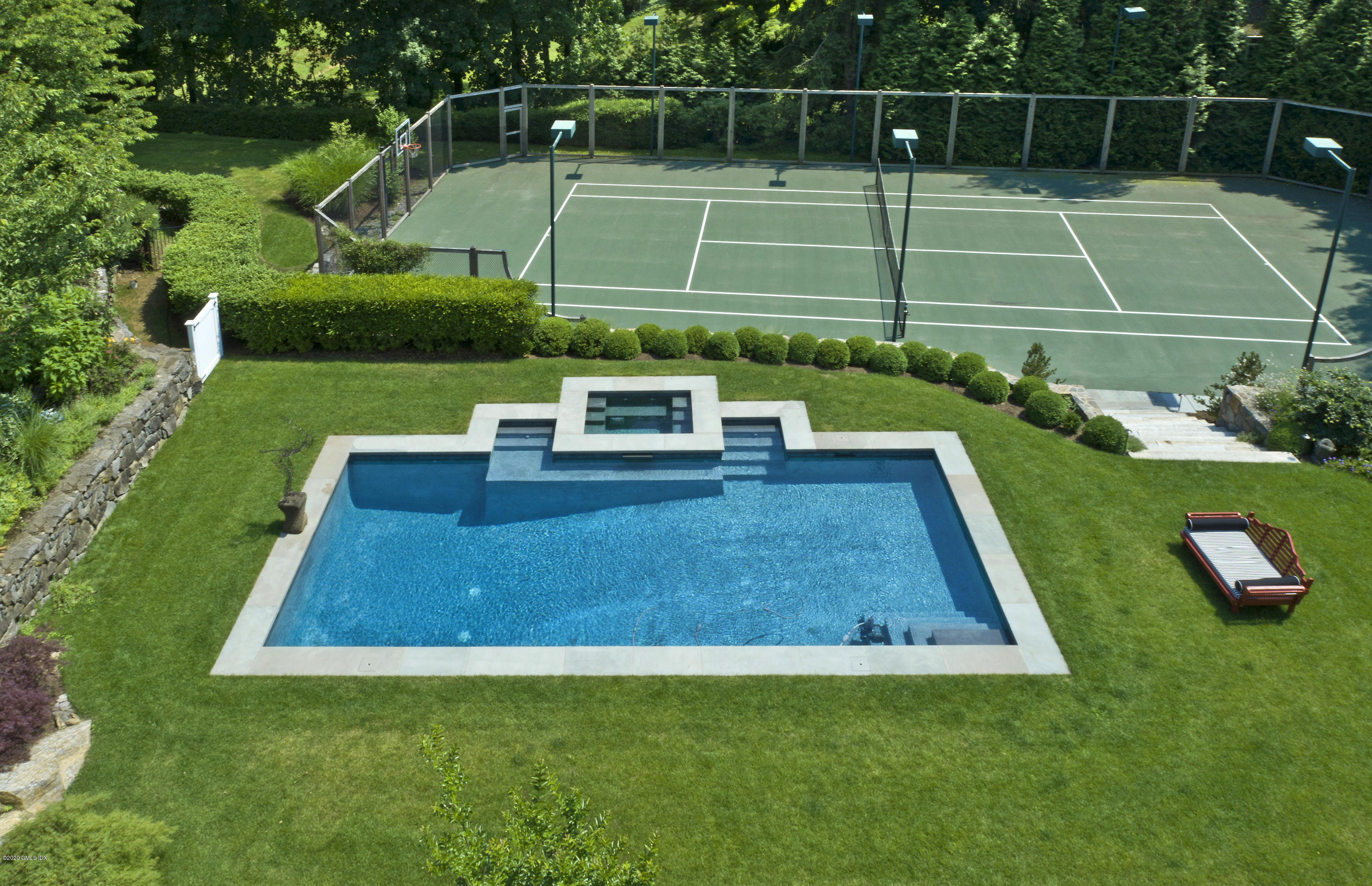 31 Rock Ridge Avenue Greenwich, CT 06831 - Photo 38 of 44 a view of a wooden deck and a big yard