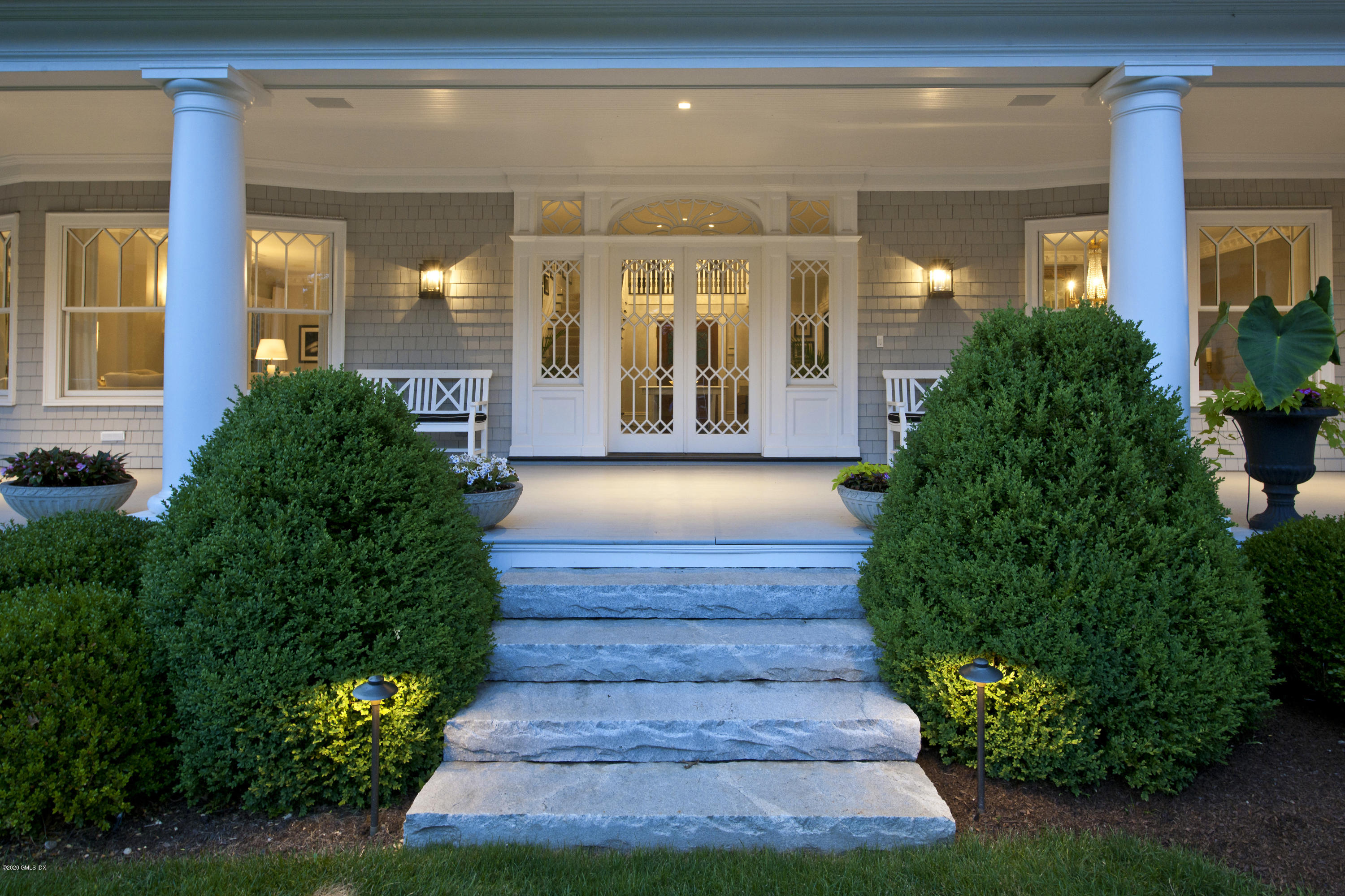 31 Rock Ridge Avenue Greenwich, CT 06831 - Photo 39 of 44 a view of a house with potted plants and a fountain