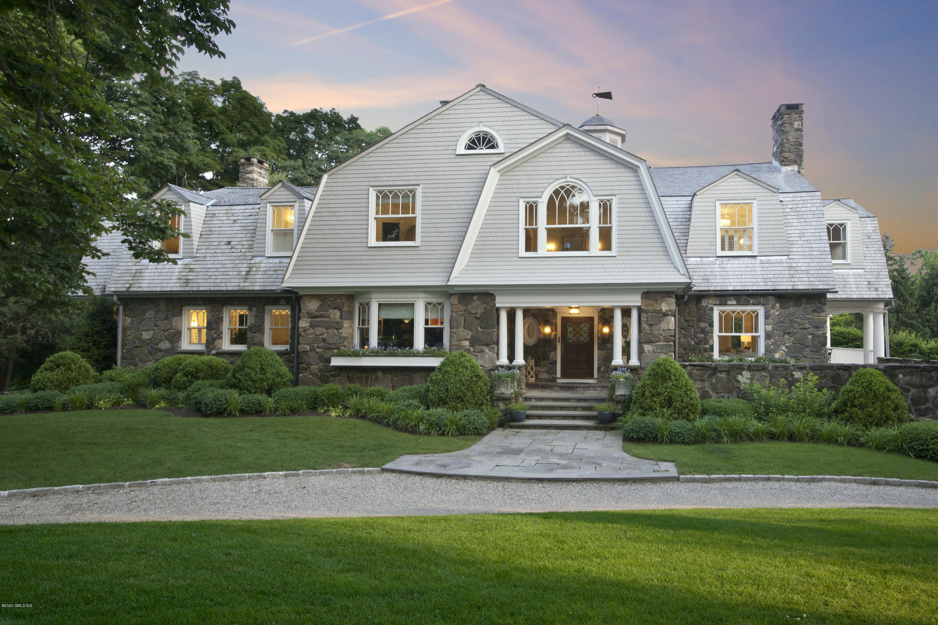 31 Rock Ridge Avenue Greenwich, CT 06831 - Photo 41 of 44 a front view of a house with a yard