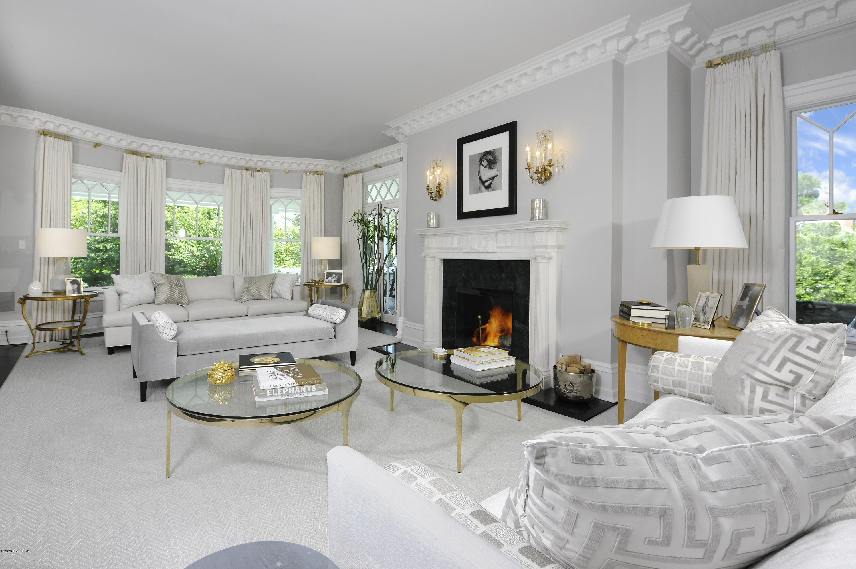 31 Rock Ridge Avenue Greenwich, CT 06831 - Photo 6 of 44 a living room with furniture a large window and a fireplace
