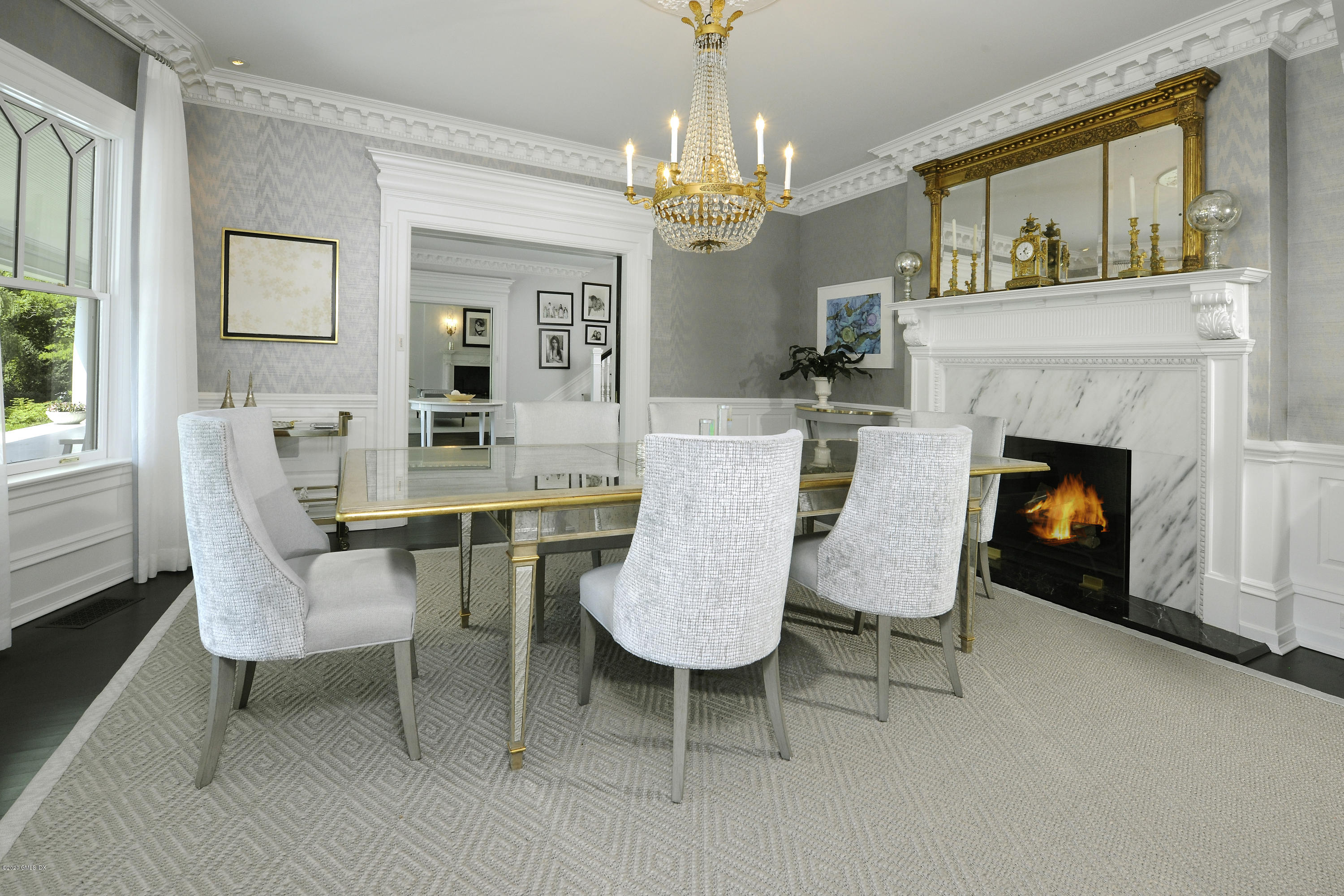 31 Rock Ridge Avenue Greenwich, CT 06831 - Photo 9 of 44 a view of a dining room with furniture a chandelier and wooden floor