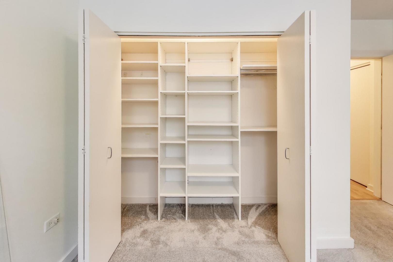 2235 West Maypole Avenue, Unit 101 Chicago, IL 60612 - Photo 13 of 19 a view of a room with shelves
