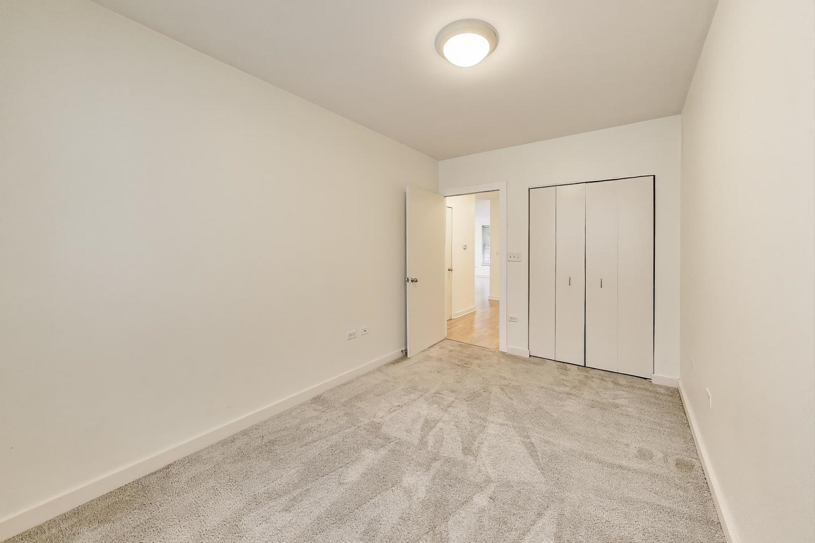 2235 West Maypole Avenue, Unit 101 Chicago, IL 60612 - Photo 15 of 19 an empty room with an entryway