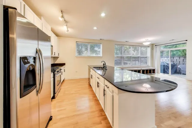 a very nice looking open dining room with a large window