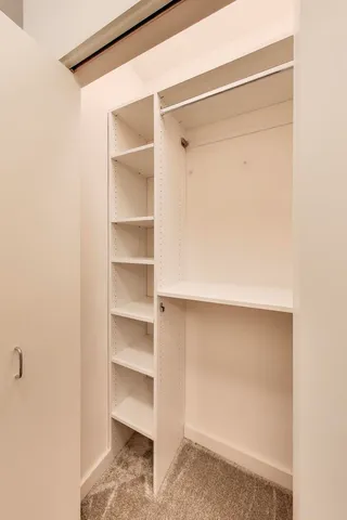 a view of an empty walk in closet