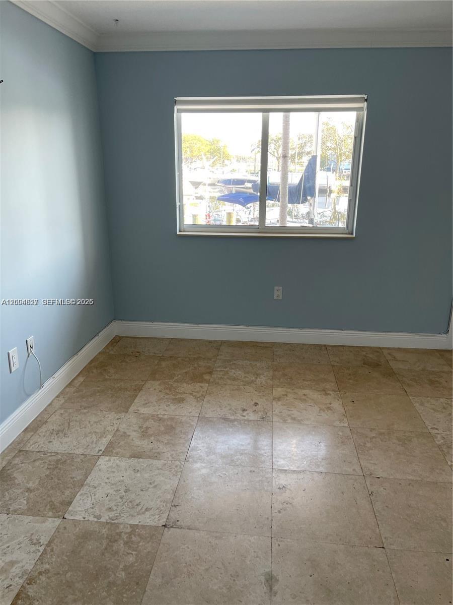 2415 Northwest 16th St Road, Unit 102 Miami, FL 33125 - Photo 6 of 19 a view of room with window