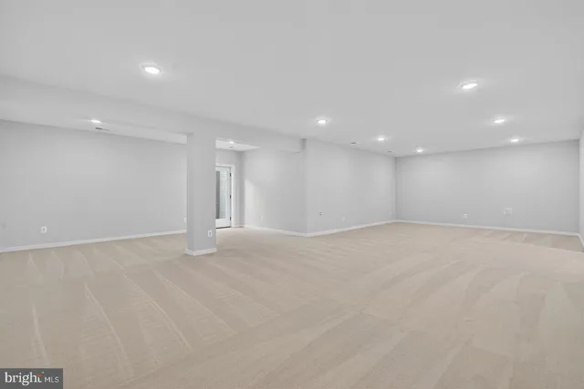 a view of an empty room with a fireplace