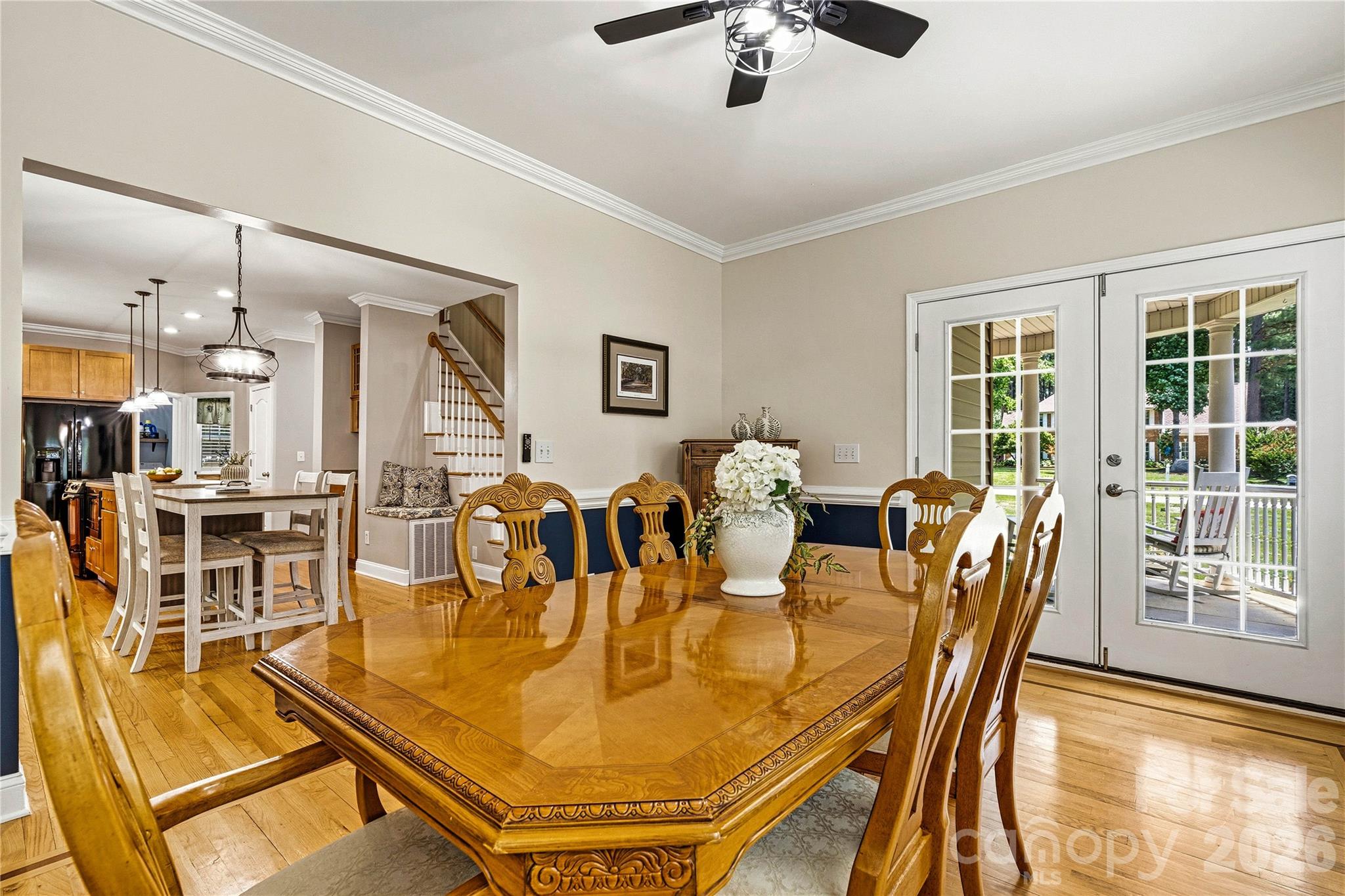 1606 High Ridge Drive Stanley, NC 28164 - Photo 14 of 44 a dining room with furniture a floor to ceiling window and wooden floor