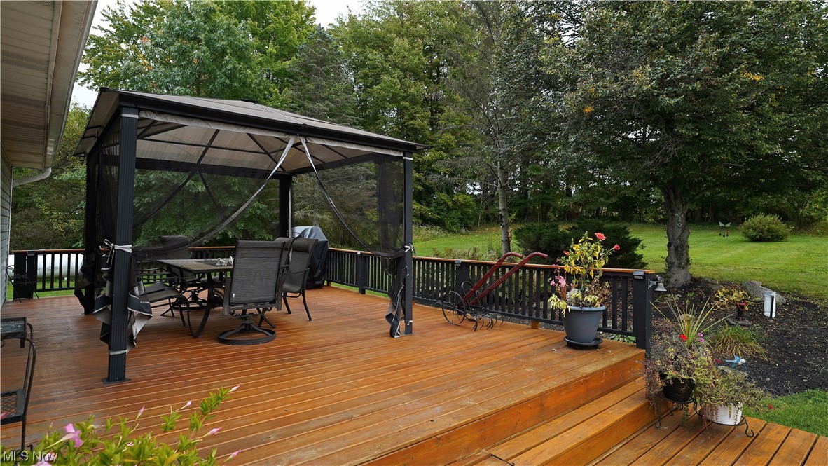 5712 Winchell Road Hiram, OH 44234 - Photo 29 of 31 Deck with a lawn and a gazebo