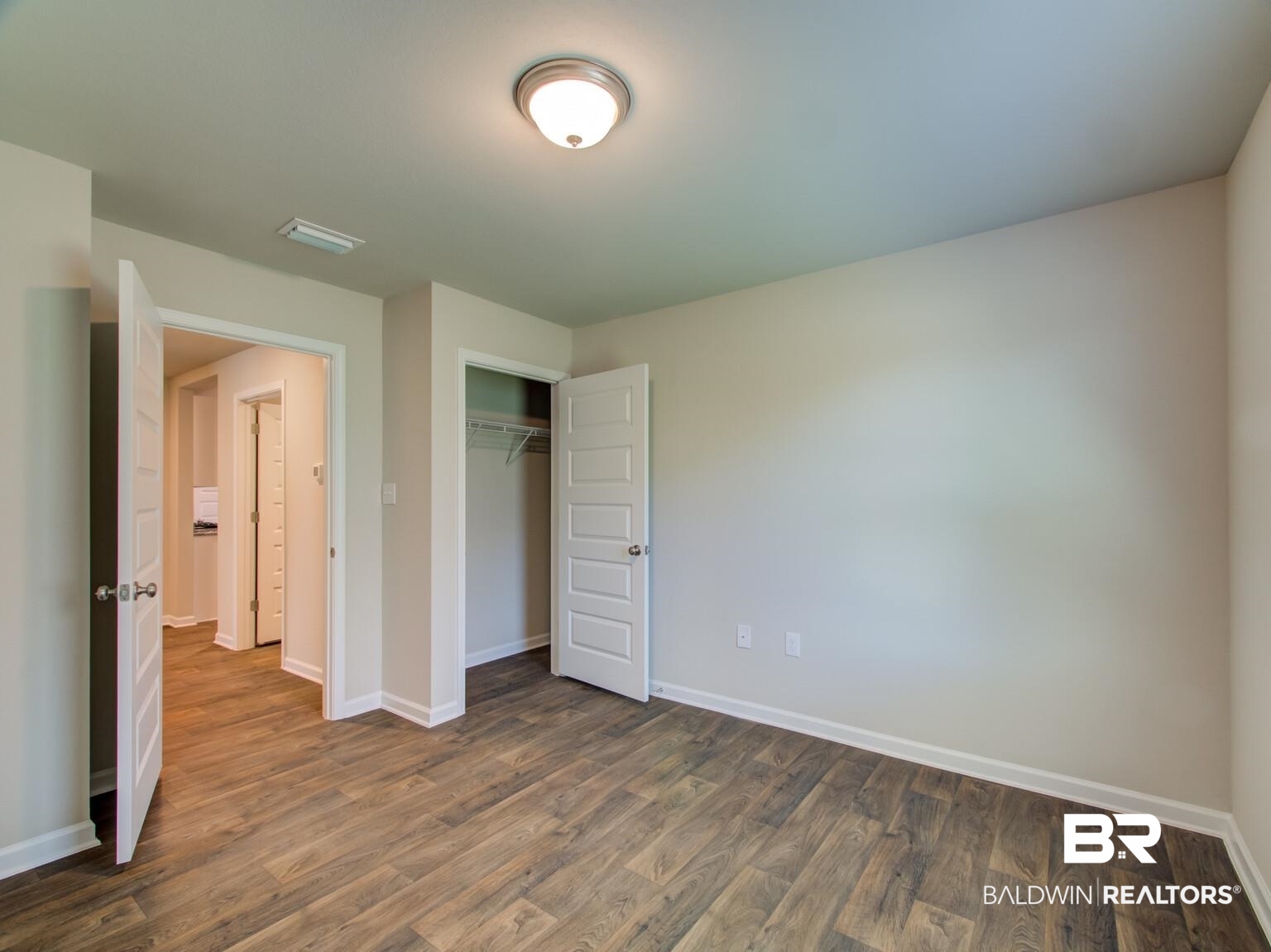 23952 Citation Loop Daphne, AL 36526 - Photo 29 of 69 Unfurnished bedroom with wood finished floors and a closet