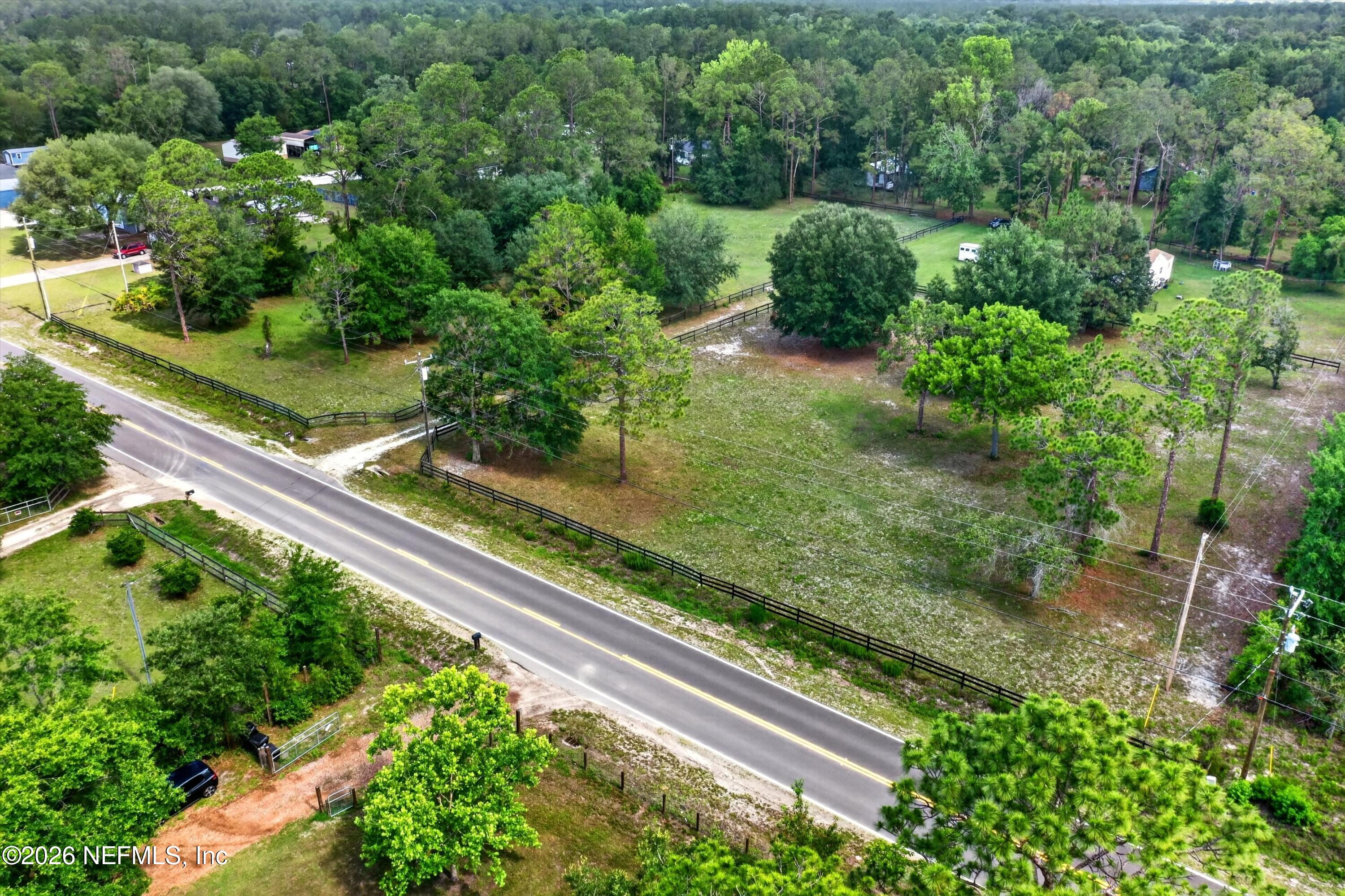 5214 Carter Spencer Road Middleburg, FL 32068 - Photo 45 of 50 a view of a yard with potted plants