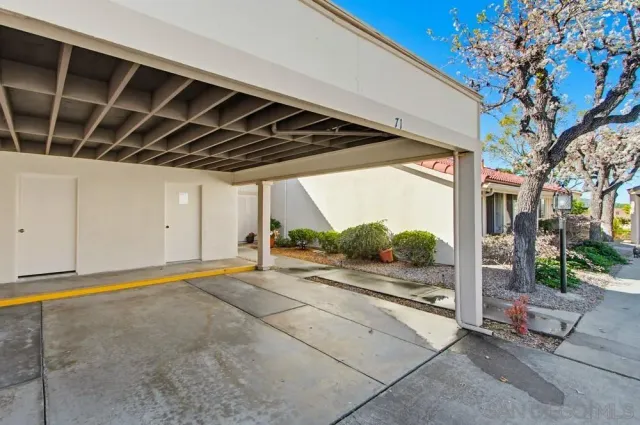 a swimming pool with outdoor seating and yard