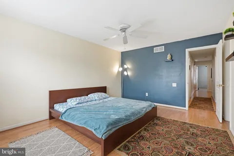 a bedroom with a bed and a table in it