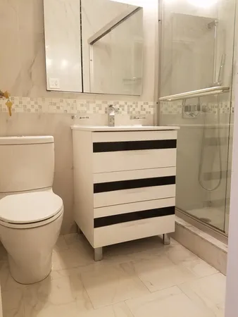 a bathroom with a toilet and a sink