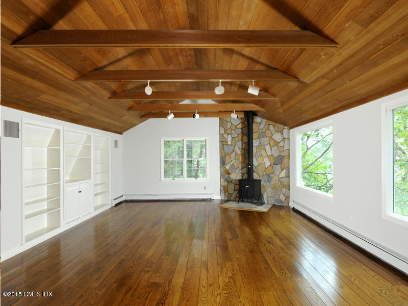 8 Indian Point Lane Riverside, CT 06878 - Photo 12 of 18 a view of an empty room with wooden floor and a window