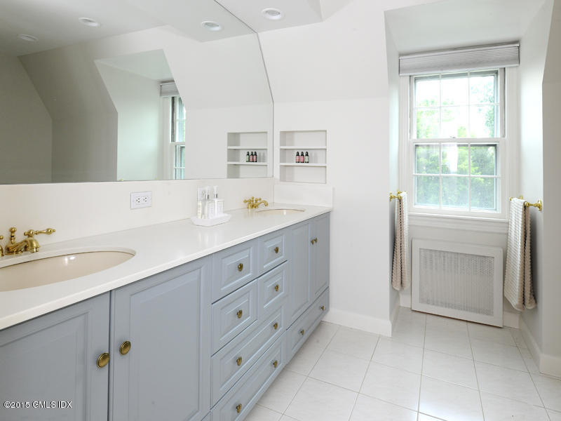 8 Indian Point Lane Riverside, CT 06878 - Photo 16 of 18 a spacious bathroom with a double vanity sink a mirror and a vanity