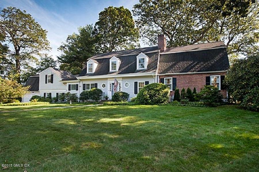 8 Indian Point Lane Riverside, CT 06878 - Photo 2 of 18 a front view of a house with a garden