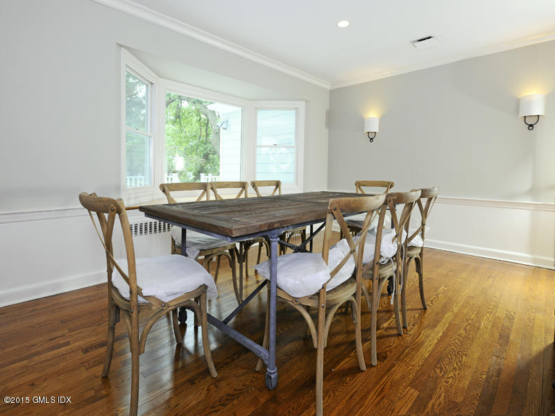 8 Indian Point Lane Riverside, CT 06878 - Photo 8 of 18 a view of a dining room with furniture window and wooden floor