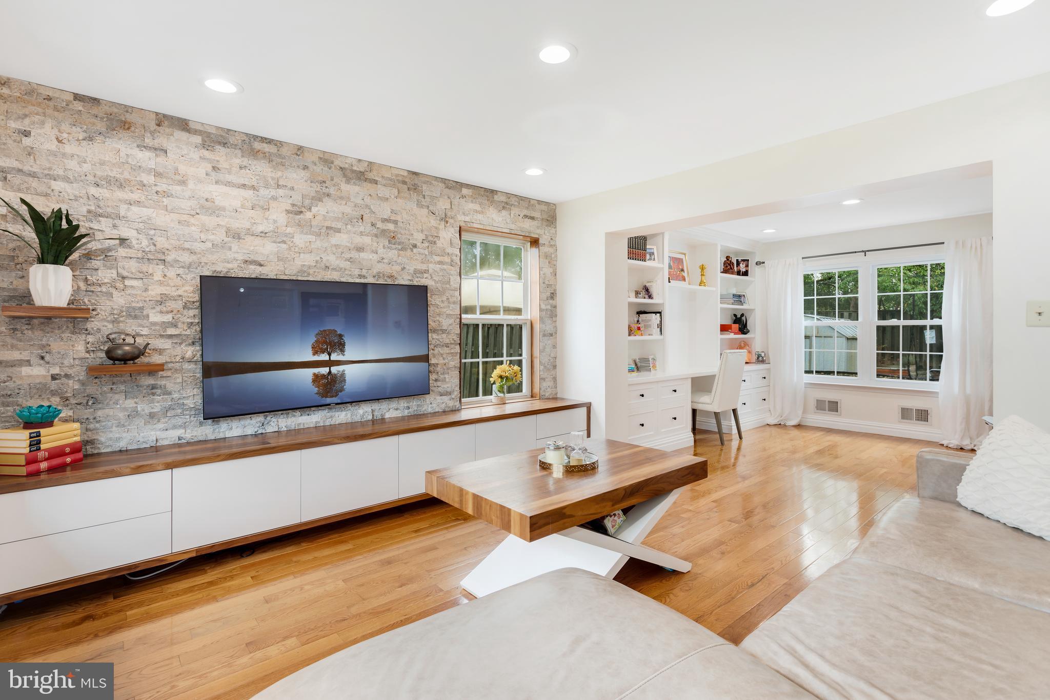135 Cornflower Road Trenton, NJ 08620 - Photo 11 of 31 a living room with furniture a flat screen tv and a table